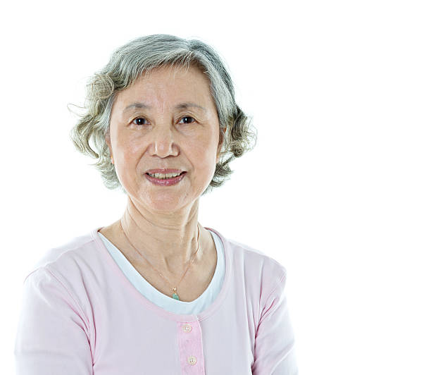 istock Attractive senior woman isolated on white background 636197032