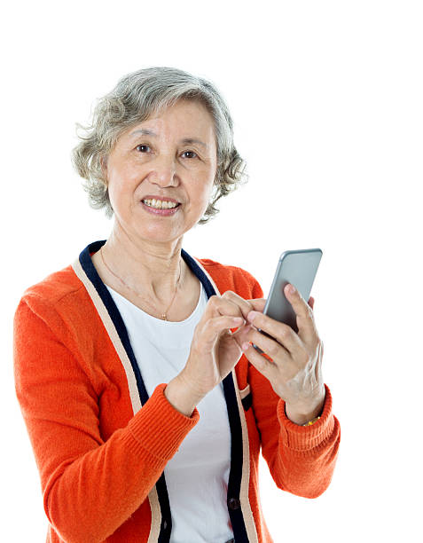 istock Asian senior woman using mobile phone 636197532