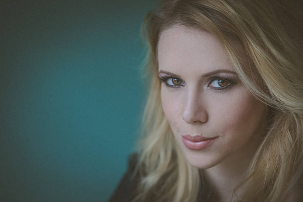 istock Woman model with professional daily make up on green background. 636198554
