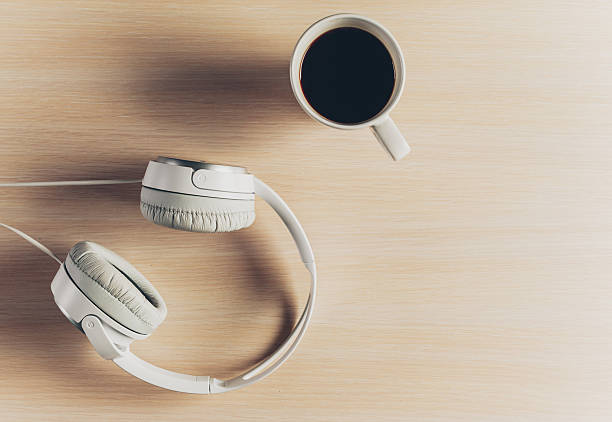 istock Headphones on wooden desk table. 636198770