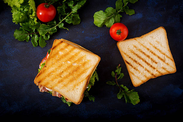 istock Big Club sandwich with ham, bacon, tomato, cucumber, cheese, eggs 636198998