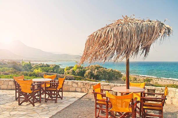 istock cafe balcony with tables at sunrise overlooking sea 636199610