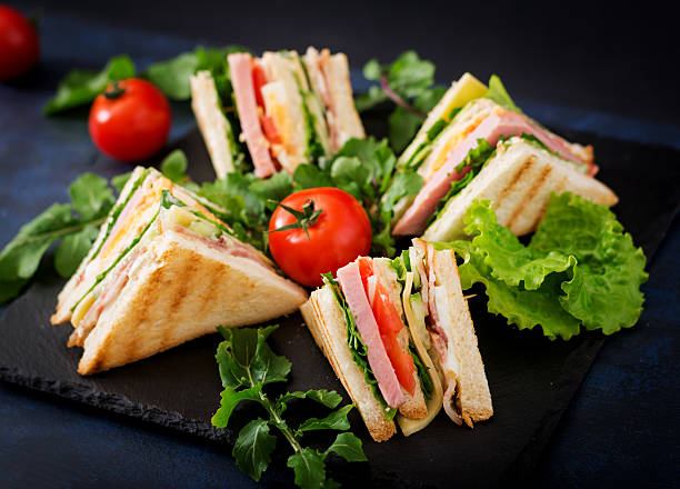 istock Club sandwich with ham, bacon, tomato, cucumber, cheese, eggs 636199686