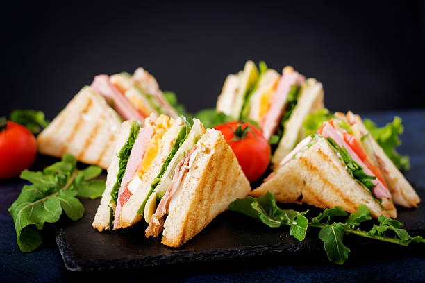 istock Club sandwich with ham, bacon, tomato, cucumber, cheese, eggs 636199732