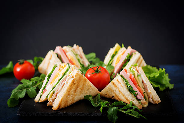 istock Club sandwich with ham, bacon, tomato, cucumber, cheese, eggs 636199774