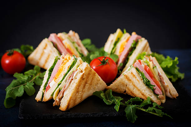 istock Club sandwich with ham, bacon, tomato, cucumber, cheese, eggs 636199822