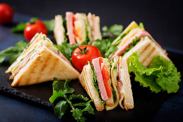 istock Club sandwich with ham, bacon, tomato, cucumber, cheese, eggs 636199872