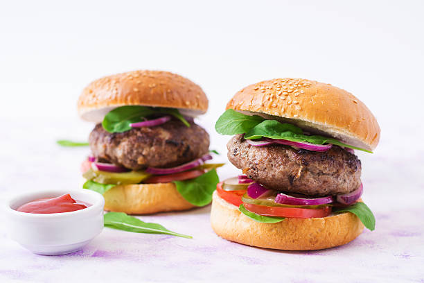 istock Big sandwich - hamburger burger with beef, tomato and onions 636200034