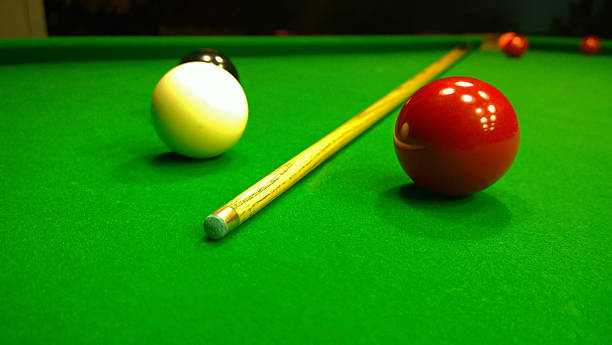 Cue and snookers balls are on the table stock photo