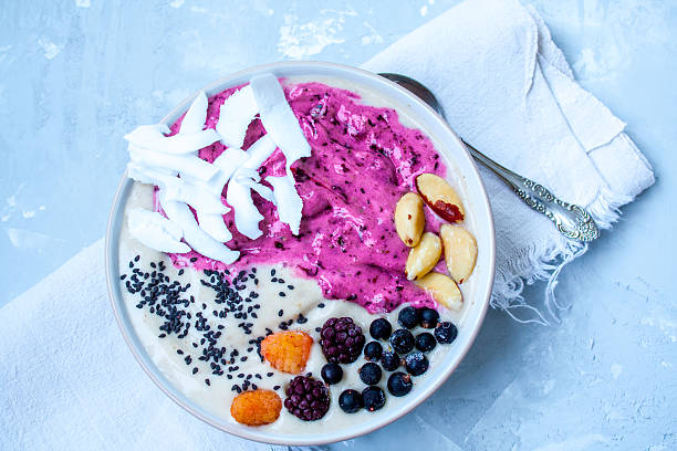 istock Breakfast purple berry smoothie bowl 636200564