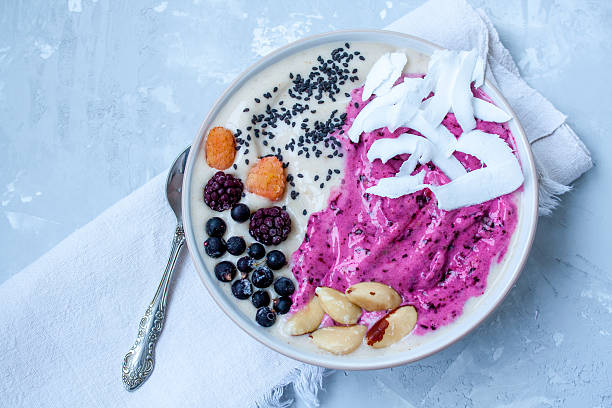 istock Breakfast purple berry smoothie bowl 636200606