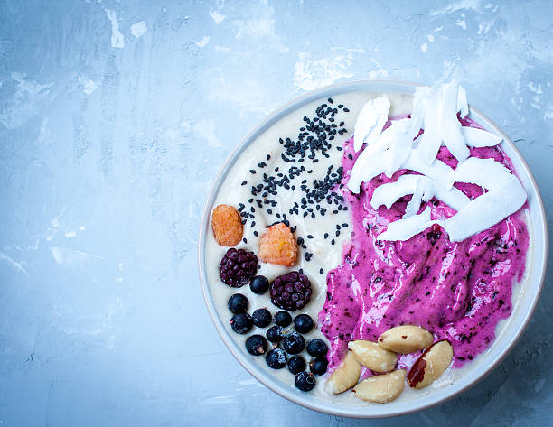 istock Breakfast purple berry smoothie bowl 636200638