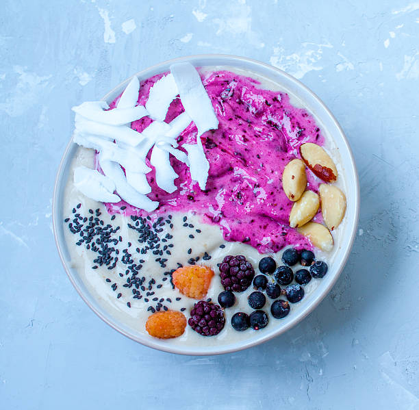 istock Breakfast purple berry smoothie bowl 636200678