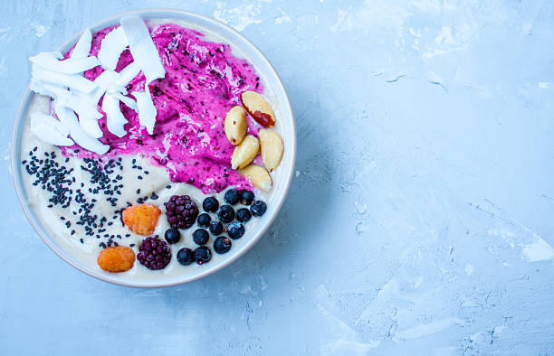 istock Breakfast purple berry smoothie bowl 636200714