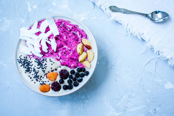 istock Breakfast purple berry smoothie bowl 636200774