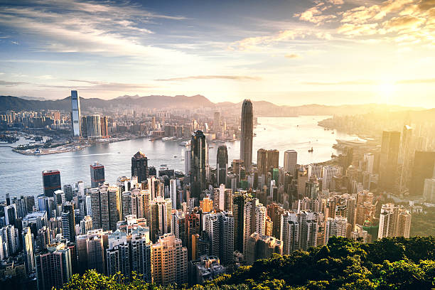istock Hong Kong skyline at sunrise 636200858