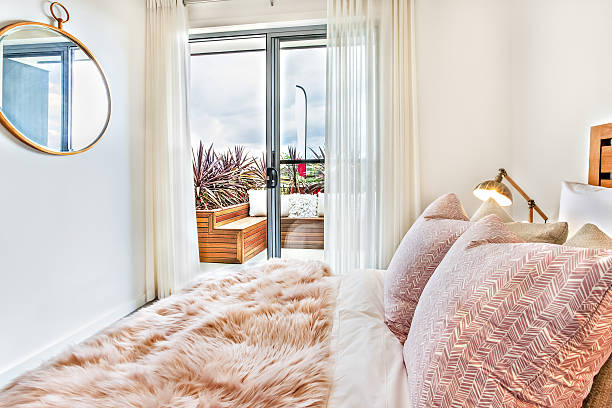 istock Modern bedroom close up illuminated by sunlight through the door 636201416
