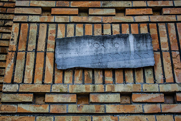 istock Ancient memorial with romanian writings, orange brick wall 636201816