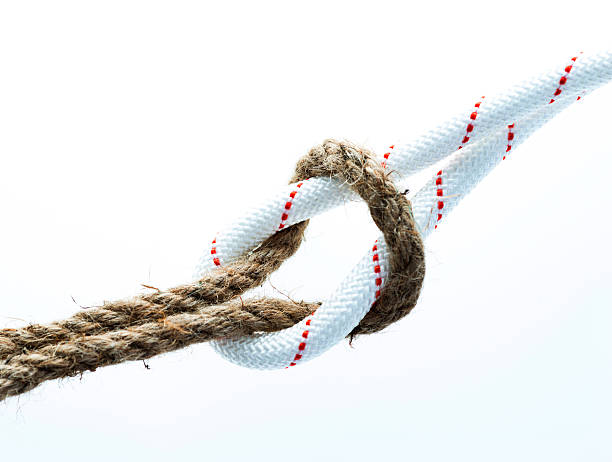 istock Rope with reef knot isolated on white background 636203554