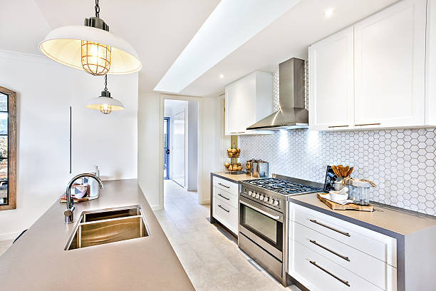 istock Luxury kitchen with an oven and stove next to pantry 636204432