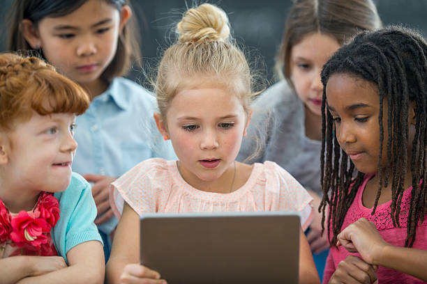 istock Girls Watching an Educational Video 636204826
