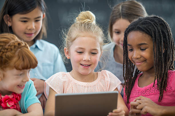 istock Watching an Educational Film on a Digital Tablet 636204870