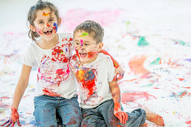istock Laughing After Finger Painting 636205444