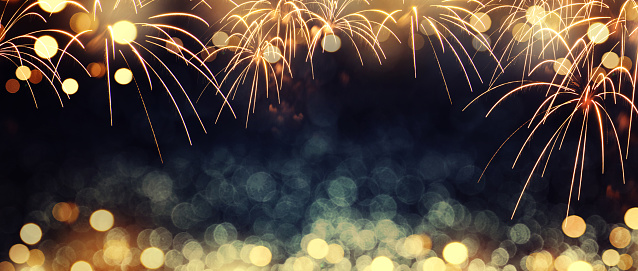 Defocused fireworks and bokeh at New Year and copy space. Abstract background holiday.