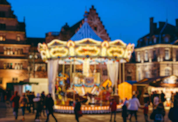 istock Defocused Christmas Market atmosphere with carousel 636209748