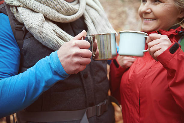 istock Couple drinking hot tea from metal mugs 636213696