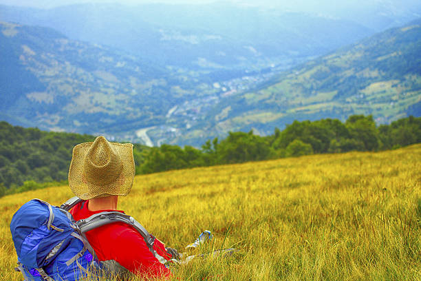 istock Man tourist walking the mountains with a backpack. 636213702