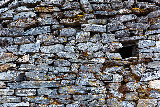 istock Stone Wall of rural Building made with manual work only 636213996