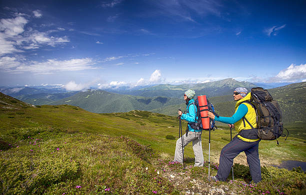 istock Man tourist walking the mountains with a backpack. 636214030