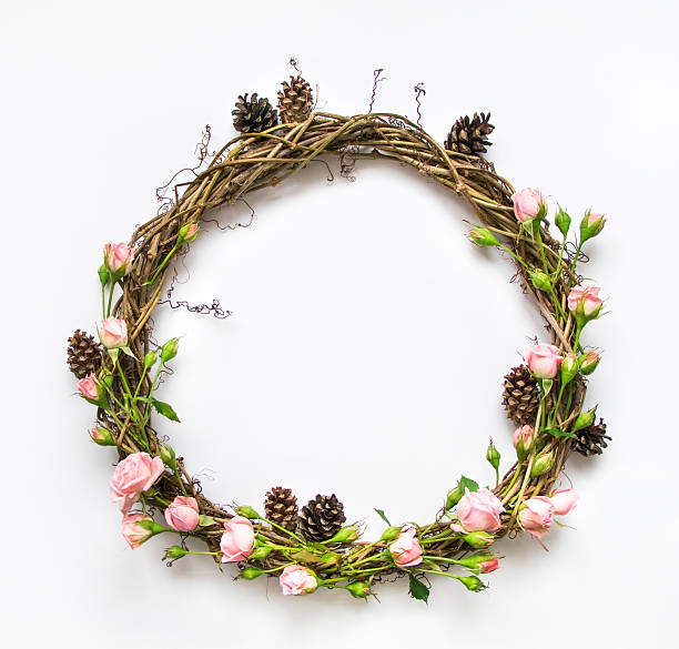 istock Wreath of vines with decorative roses and cones. Flat lay 636214130