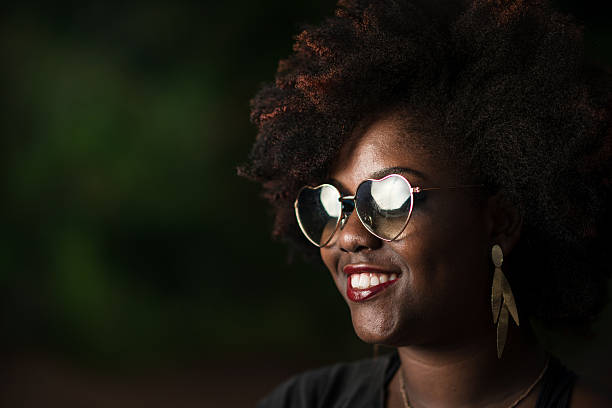 istock Afro brazilian young woman using sunglasses 636214308