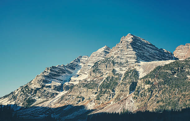 istock Retro toned Maroon Bells mountain range, USA. 636215392