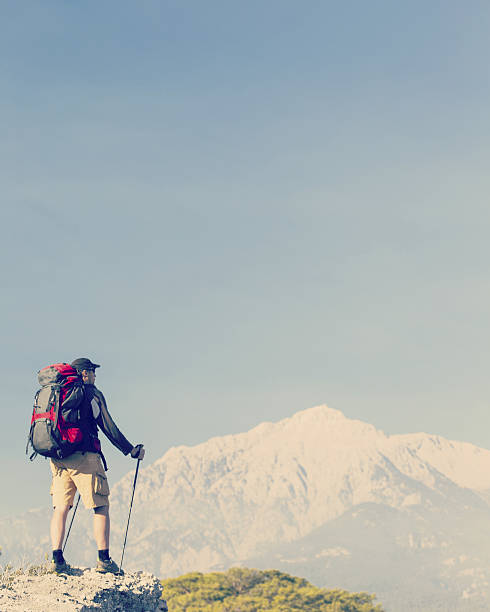 istock Man tourist walking the mountains with a backpack. 636215766