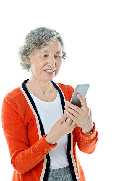 istock Asian senior woman using mobile phone 636216848