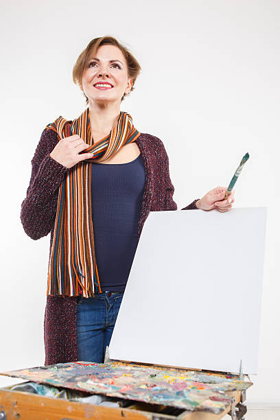 istock Artist woman at work. Isolated. 636219202