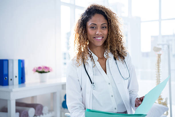 istock Portrait of physiotherapist holding clipboard 636220770