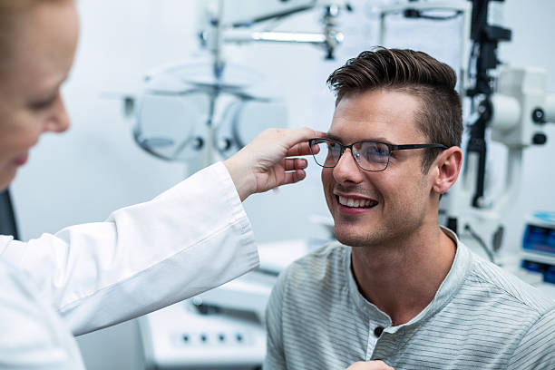 istock Female optometrist prescribing spectacles to patient 636220884
