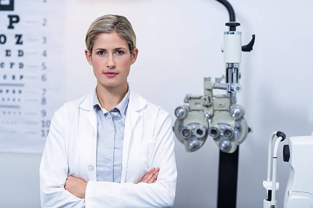 istock Female optometrist standing in ophthalmology clinic 636221280