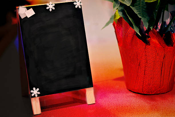 istock Blank chalkboard sign with snowflakes 636225232