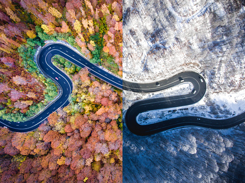 Winding road autumn vs. winter. Aerial view.