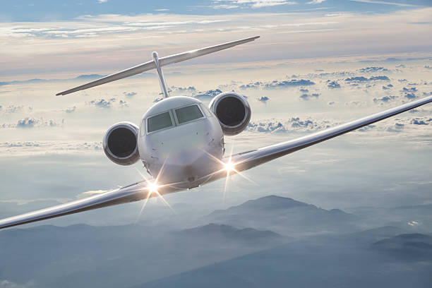 istock Private airplane fly over clouds at dusk 636231714
