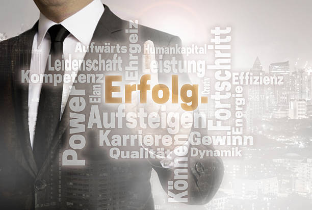 istock Businessman with urban background Erolg (in german success) word 636232286