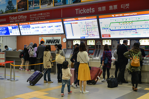Osaka, Japan - November 16, 2016: Many tourists are buying tickets at Kansai airport railway station, Osaka, Japan