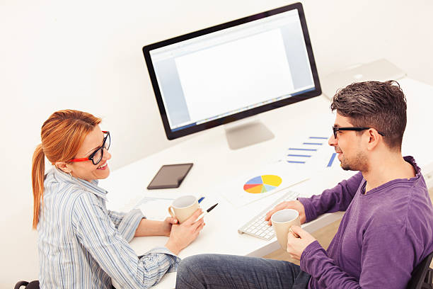 istock Business people having coffee break and communicating at home 636233652