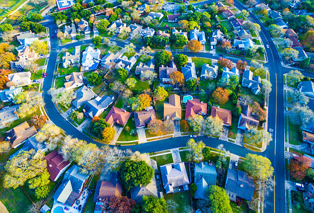 istock Colorful Fall Aerial Homes in Modern Suburb 636235872