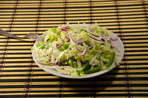 istock Chinese cabbage salad with green pepper and onion 636236852